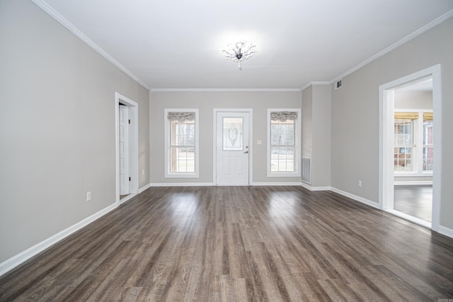 interior space featuring an inviting chandelier, crown molding, and dark hardwood / wood-style floors