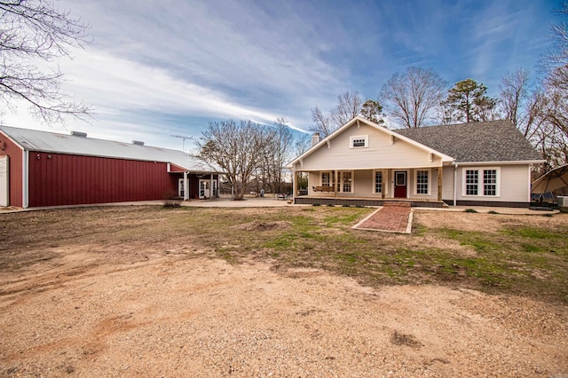 back of house with a porch