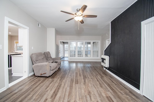 living room with sink, ceiling fan, and hardwood / wood-style flooring