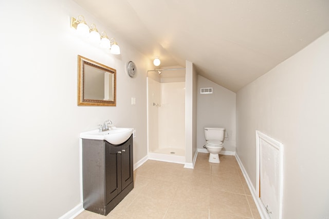 bathroom featuring vanity, lofted ceiling, a shower, and toilet