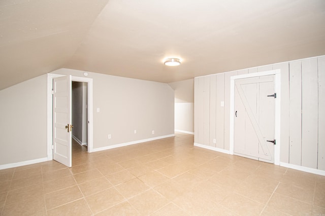 additional living space with vaulted ceiling