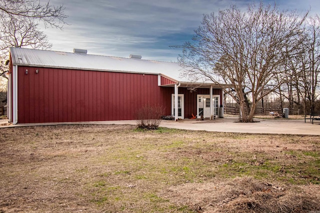 exterior space with a patio area and a front lawn