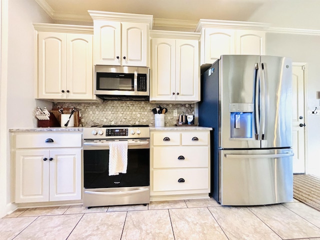 kitchen with ornamental molding, stainless steel appliances, light tile patterned flooring, and backsplash