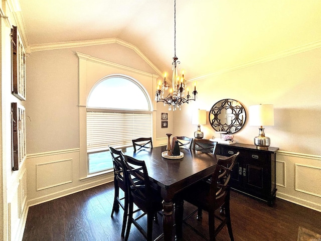 dining space with dark wood-type flooring, vaulted ceiling, crown molding, and a chandelier