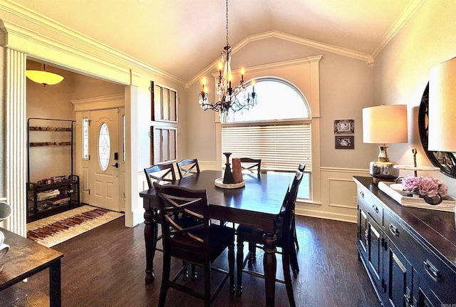 dining area featuring ornamental molding, vaulted ceiling, dark hardwood / wood-style flooring, and a healthy amount of sunlight