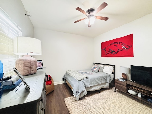 bedroom with ceiling fan and wood-type flooring