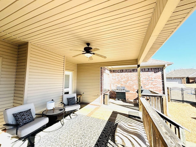 view of patio featuring ceiling fan and a grill