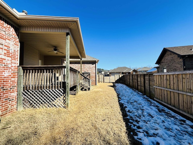 view of yard with ceiling fan