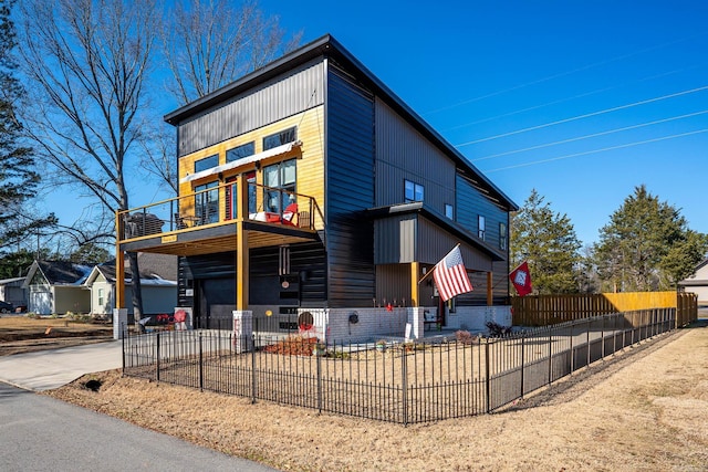 view of front of home with a balcony