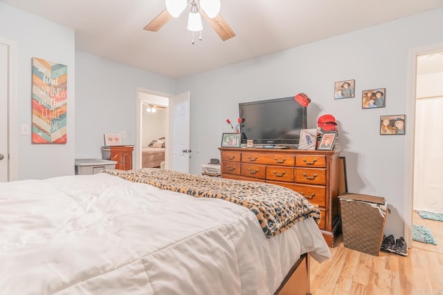 bedroom with ceiling fan and light hardwood / wood-style floors