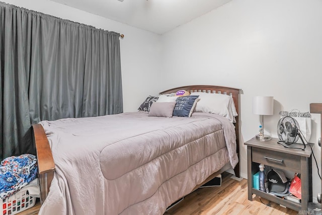 bedroom with hardwood / wood-style floors