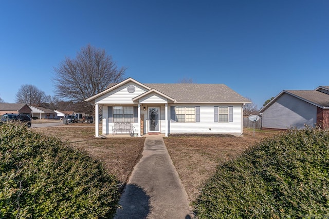 view of front facade with a front yard and a porch