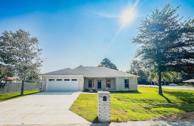 ranch-style home with a front yard and a garage