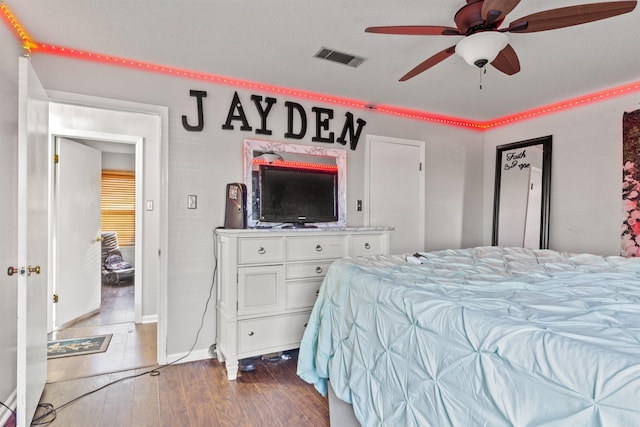 bedroom featuring wood-type flooring and ceiling fan