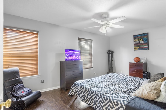 bedroom featuring ceiling fan and dark wood-type flooring