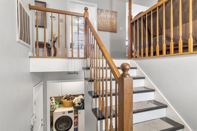 stairway featuring washer / clothes dryer