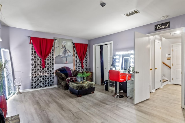 living area with light hardwood / wood-style floors