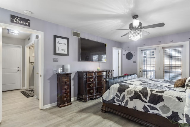 bedroom featuring access to outside, ceiling fan, and light hardwood / wood-style floors