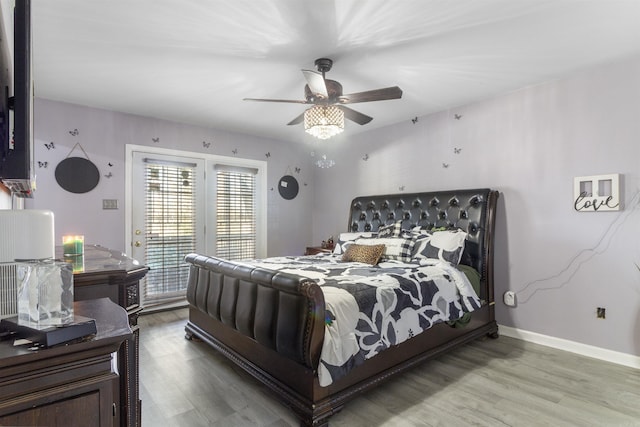 bedroom with ceiling fan and hardwood / wood-style floors