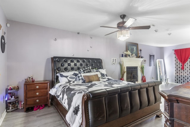 bedroom featuring ceiling fan and light wood-type flooring