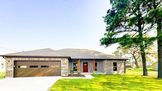 view of front facade with a front yard and a garage