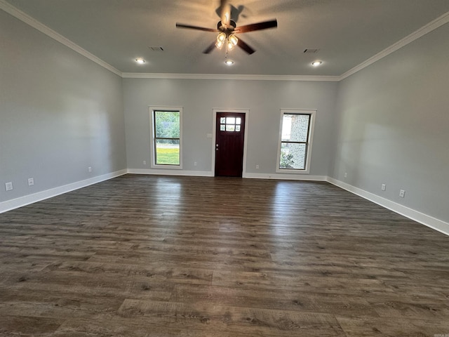 interior space with dark wood-type flooring, ceiling fan, and crown molding