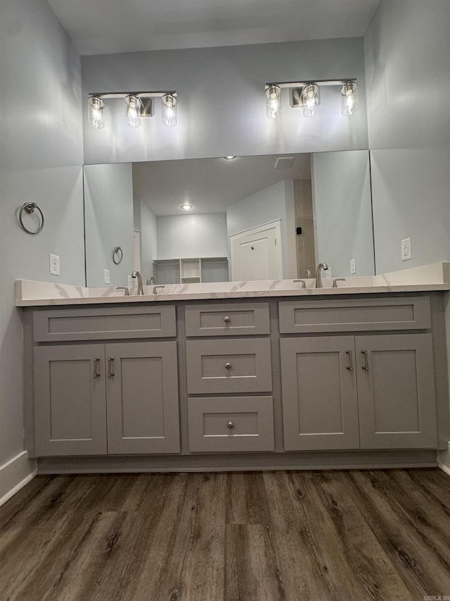 bathroom with vanity and hardwood / wood-style flooring