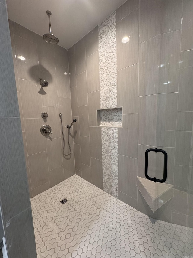 bathroom with a shower with shower door