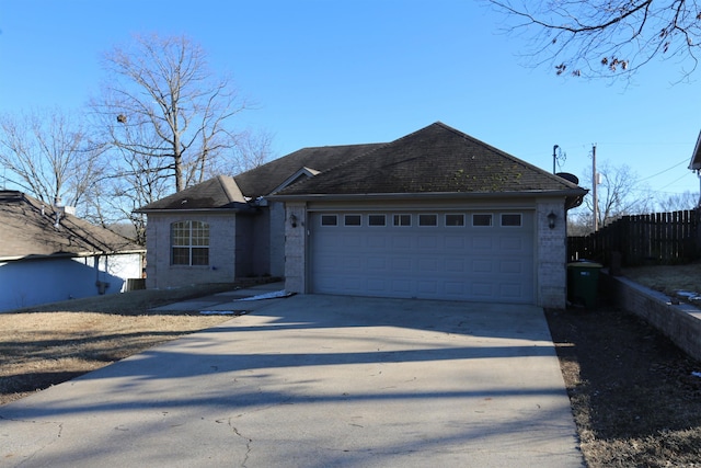 single story home with a garage