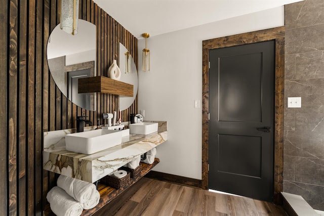 entryway with sink and hardwood / wood-style floors