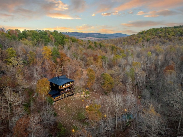 aerial view at dusk featuring a mountain view