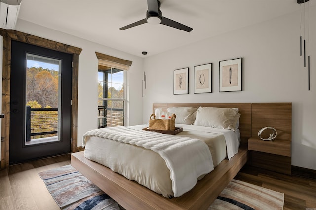 bedroom featuring wood-type flooring, access to exterior, and ceiling fan