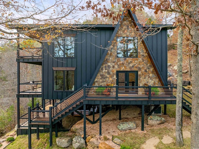 back of property featuring french doors and a wooden deck