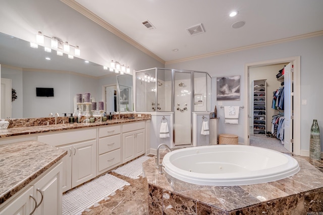 bathroom with plus walk in shower, crown molding, and vanity