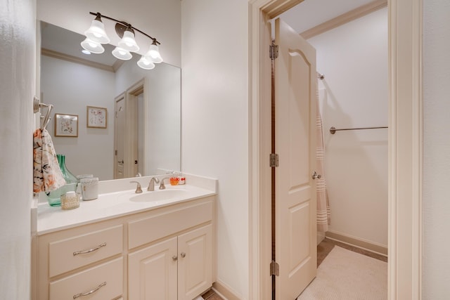 bathroom featuring vanity and crown molding