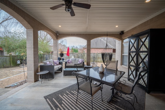 view of patio featuring an outdoor living space and ceiling fan