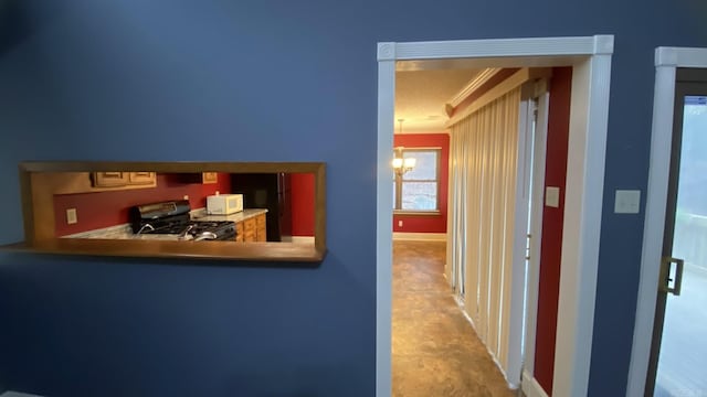 interior space featuring a chandelier and ornamental molding