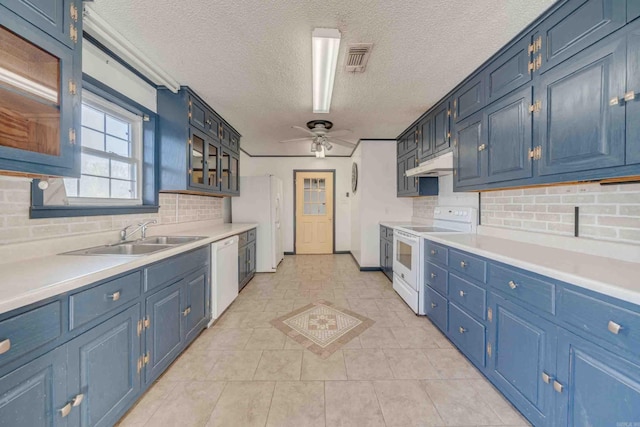 kitchen with ceiling fan, blue cabinets, and white appliances