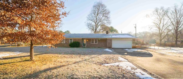 ranch-style house featuring a garage