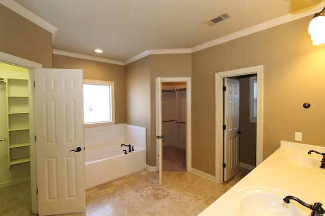 bathroom featuring a bath, ornamental molding, and vanity