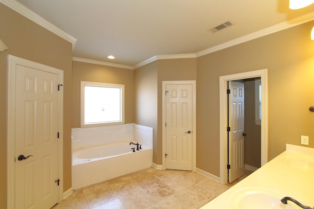 bathroom with crown molding, vanity, and a washtub