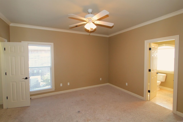 unfurnished bedroom featuring ceiling fan, connected bathroom, crown molding, and light carpet