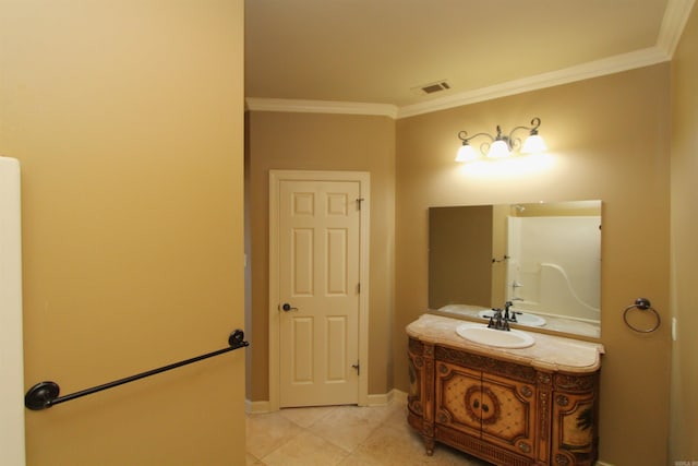 bathroom featuring ornamental molding, tile patterned flooring, and vanity