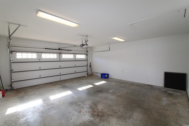 garage featuring a garage door opener