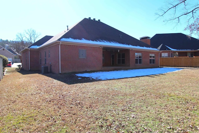 rear view of house with a patio and central AC