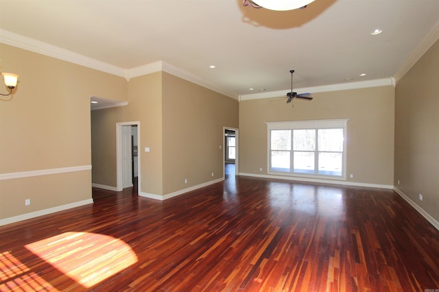 unfurnished living room featuring dark wood-type flooring, ornamental molding, and ceiling fan