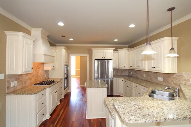 kitchen with premium range hood, pendant lighting, sink, crown molding, and stainless steel appliances