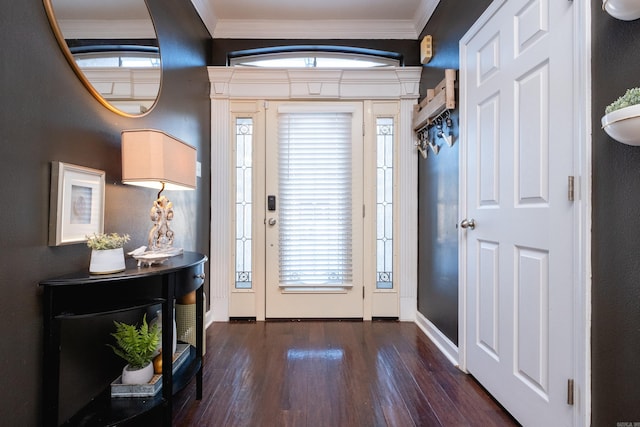 foyer with plenty of natural light, ornamental molding, and dark hardwood / wood-style floors