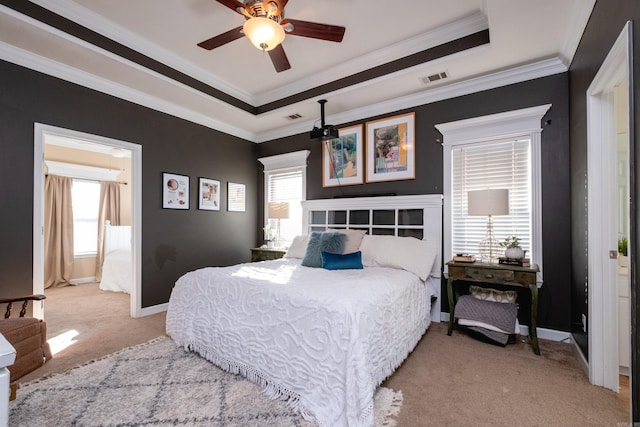 carpeted bedroom featuring ceiling fan, multiple windows, and ornamental molding