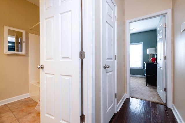 corridor with wood-type flooring